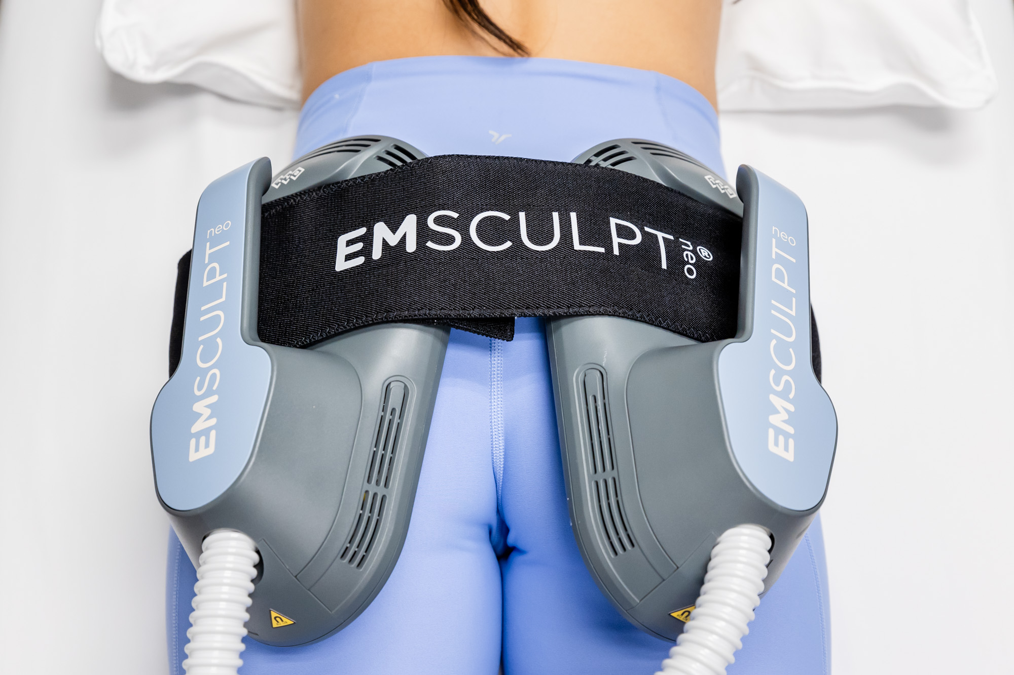 A woman undergoes targeted Emsculpt in Tri-City.