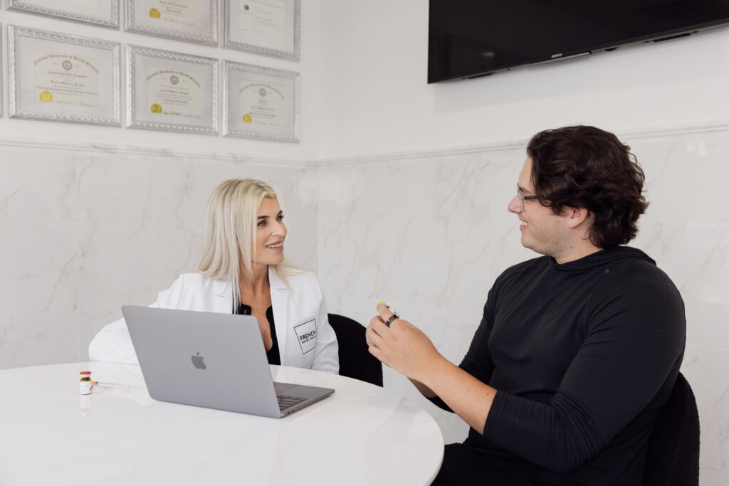 A man sits down for a consultation with one of our expert providers at our clinic for weight loss in St. Charles, IL, to learn more about how we would customize his weight loss program.
